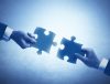Two puzzle pieces depicting integration that benefits agency staff